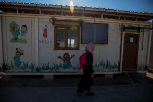Basma walks to class at a Save the Children school