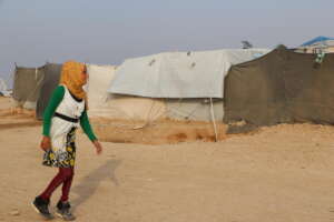 Now Zahida walks across camp to go to school.