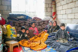 Nesreen and her children. IHSAN/CARE