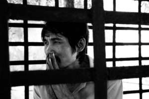Patien is sitting in the metal cage