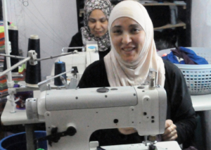 Rashedeh in her tailoring shop