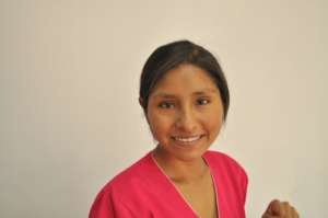 Aracely in bright pink scrubs