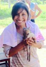 Aracely with wild piglet