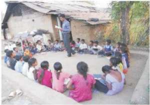 Para teacher teaching children in class room
