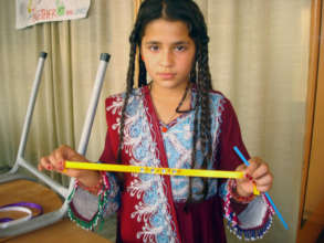 Aisha with her Bayram bracelet gift from Mohammed