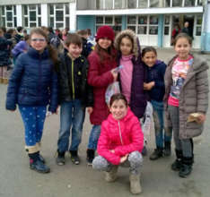 Smiling Asja and Jasmine with their school peers