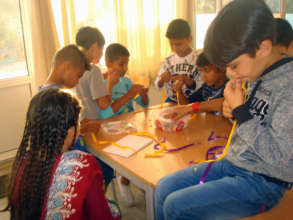 Mohammed making his friendship bracelet