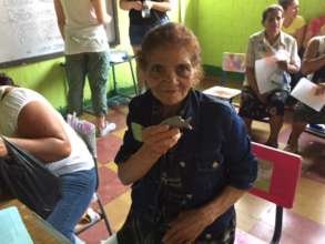 Woman receives Lucky Iron Fish
