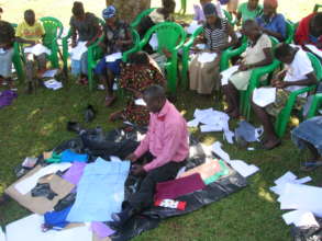 Girls and their guardians gather to learn sewing