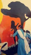 Drawing a mural in school