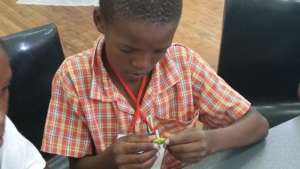 Anathi concentrating during robotics