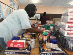 ORT SA CAPE volunteer packing food parcels