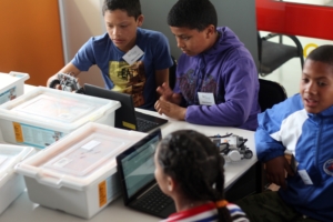 Some of the older children working on their robots