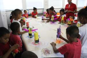 Children drawing with the art-bots they decorated