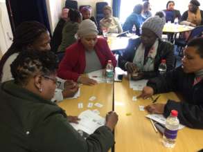 Nomampondo (in the red cardigan) at a workshop