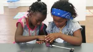 Phozisa and her friend working with LittleBits