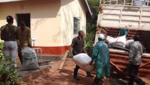 DNRC staff loading moringa seeds