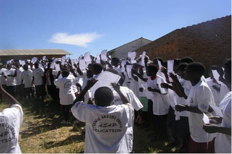 Children celebrate graduation at a field day in Mutasa District