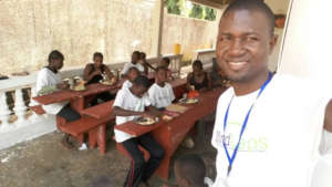 Martin with students during the meal program
