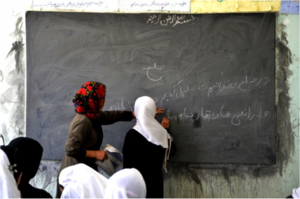 Students at chalkboard (Ayni)