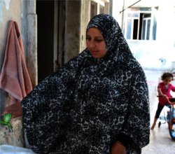 Um collecting water for her family