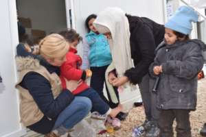 Providing winter clothing to refugees in Serbia