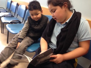 Allison reads to her brother Deric