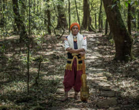 Pynshailang stands small among the tall trees