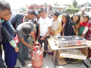 Demonstrating an LPG cooking stove to Khasi women