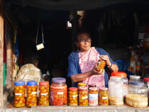 Drasmina in her shop selling tea and pickles