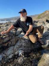 Austin at CA shore: note Samoan Reefs of Hope logo