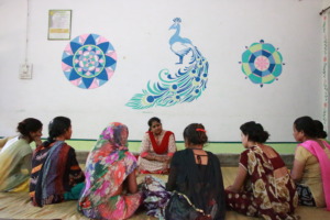 Nisha interacting with women in Short Stay Home