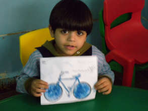 A young boy showing his artwork in Lebanon