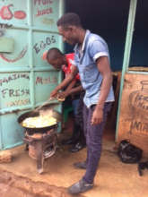 Bizimana and Otto cooking mandazi