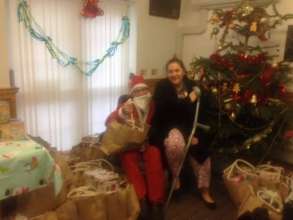 Santa sharing the donated Christmas presents