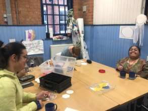 The indoor activities group making coasters.
