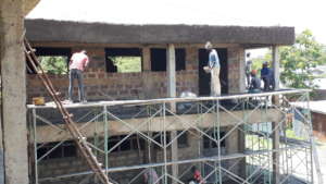 The site workers doing final exterior work