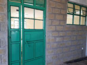Classroom doors painted and window glasses fitted