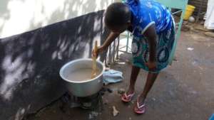 Beneficiary preparing a meal at the GEC