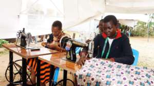 Girls doing their dressmaking practical session
