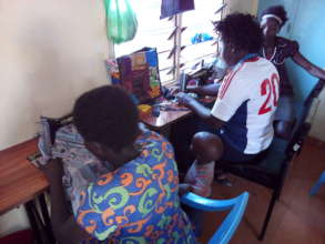 Part of the girls during the dressmaking session