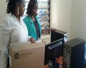 Staff receiving computers at the GEC