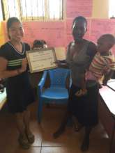 NIGEE beneficiary receiving her certificate