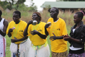 Project participants performing songs and dances