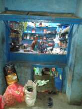 Rubi sitting inside her shop