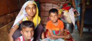 Manjila with her sons at home