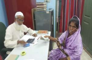 Soni in our office to receive her grant