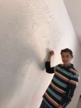 Fernando Draws Mural for New Store