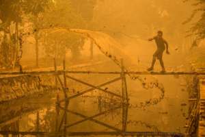 Man fishing in yellow toxic air