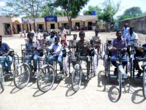 Tricycles,hearing aids,specs to disable children